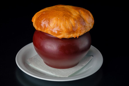 Russian traditional dish - potatoes in a red potの写真素材