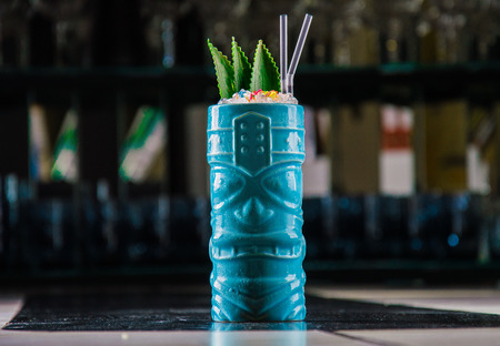 Delicious exotic cocktail in a glass of Voodoo. Decorated with pineapple leavesの写真素材