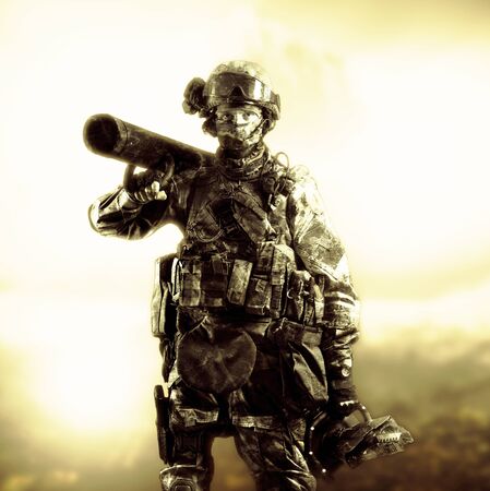 The soldier of the special unit stands in military uniform with a ram on his shoulder and a device for opening the doors. Mixed mediaの写真素材