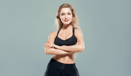 Charming athlete does warm-up before training. Mixed mediaの写真素材