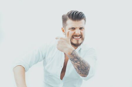 The boss points the subordinate to the exit! The concept of dismissal, crisis, job cuts, instability. Mixed mediaの写真素材