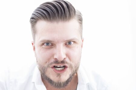 Angry man is very aggressively looking at the camera. Concept of bad work, strict boss, deal failure. Mixed mediaの写真素材