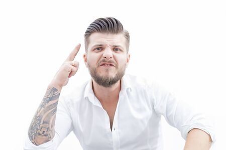 Angry man threatens his opponent. The concept of domestic violence, drunkenness, misfortune. Mixed mediaの写真素材