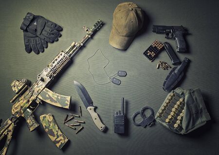 Military accessories, survival kit, military campaigns. The concept of war and instability in the world. Aggressors and defenders. Mixed mediaの写真素材