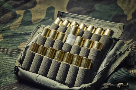 Set of cartridges for a shotgun. The concept of hunting, military ammunition, shops selling weapons. Mixed mediaの写真素材