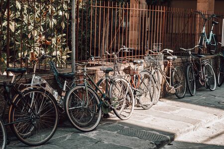 Florence street is full of bicycles. Tourism and travel concept. Mixed mediaの写真素材