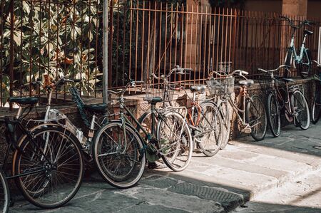 Florence street is full of bicycles. Tourism and travel concept. Mixed media