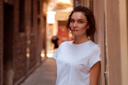 Portrait of a charming girl who poses on one of the streets of Venice. Mixed media