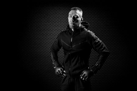 Mixed Martial Arts fighter posing on a metal grid background. Concept of mma, ufc, thai boxing,...