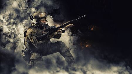 Portrait of a special forces soldier who reloads an assault rifle. The concept of military units. Computer games. Mixed mediaの写真素材
