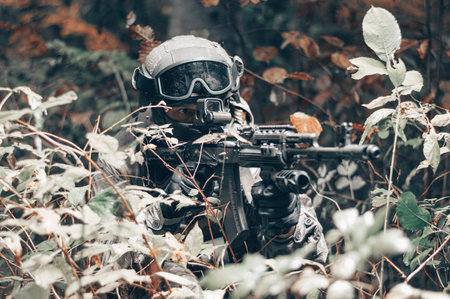 Portrait of a commando in the forest. The concept of military operations, international conflicts, special forces. Mixed mediaの写真素材