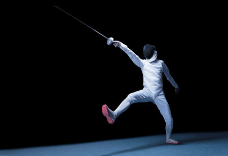 The fencer moves forward with a sword in his hand. Sport concept. Mixed media