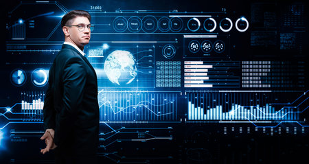Confident man is standing in a business suit on the background of a stock exchange hologram. Stock...