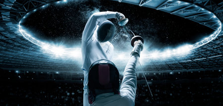 Portrait of two fencers against the backdrop of a sports arena. The concept of fencing. Duel. Mixed...