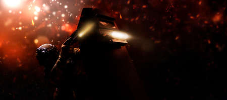 Portrait of a fighter of a special unit. He hides behind a bulletproof shield. Background of war. The concept of the fight against terrorism. Mixed mediaの写真素材