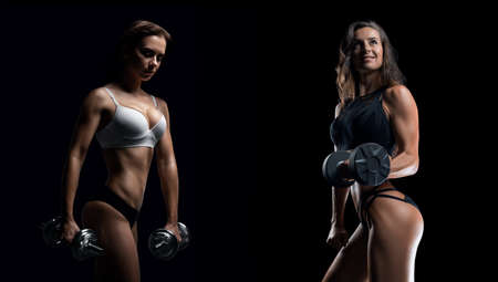 Two sportswomen posing with dumbbells against the background of a blue spot. Bodybuilding concept. Mixed mediaの写真素材