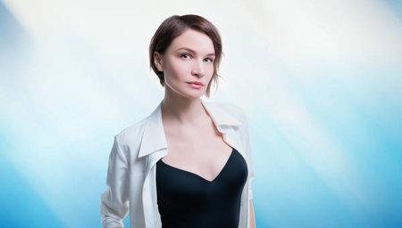 Charming adult business woman with perfect clean skin posing in studio. Skin care concept. Mixed mediaの写真素材