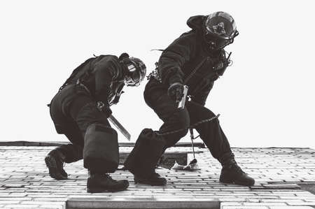 Two commandos train at the base. Climbers. SWAT, police, counterterrorism concept. Mixed mediaの写真素材