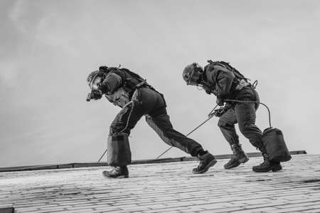 Two commandos train at the base. Climbers. SWAT, police, counterterrorism concept. Mixed mediaの写真素材