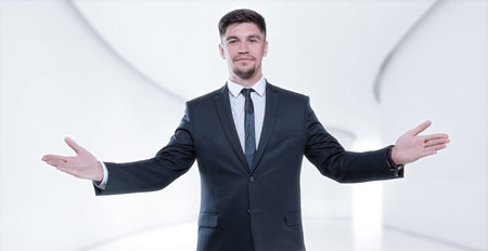 Image of a stylish man in a suit with open arms. Business concept. Mixed media
