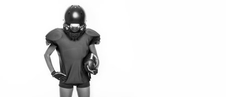 Black and white images of a sports girl in the uniform of an American football team player. Sports concept. White background. Mixed mediaの写真素材