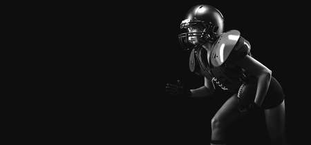 Portrait of a girl in the uniform of an American football team player. Black background. Sports concept. Mixed mediaの写真素材