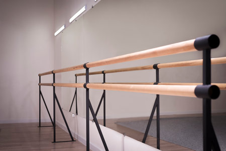 Image of wooden bars in a dance studio. The concept of dancing, ballet. Professional equipment. Mixed mediaの写真素材