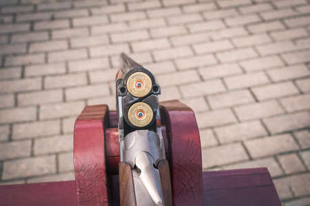 Image of a shotgun with loaded cartridges. Hunting concept.の写真素材
