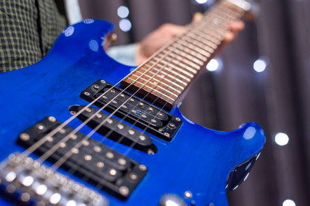 Image of a blue electric guitar close-up. The concept of tuning and repairing musical instruments. Mixed mediaの写真素材