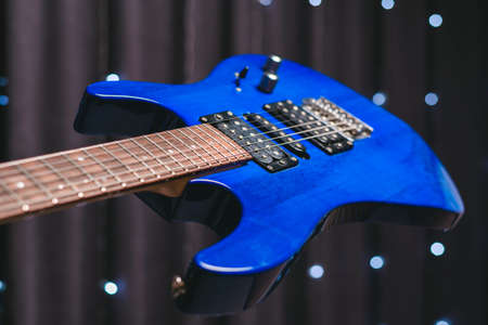 Close-up image of a blue electric guitar. Mixed mediaの写真素材