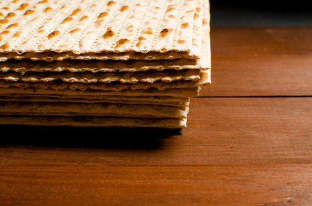 traditional Jewish kosher matzo for Easter pesah on a wooden table. Jewish Easter food....