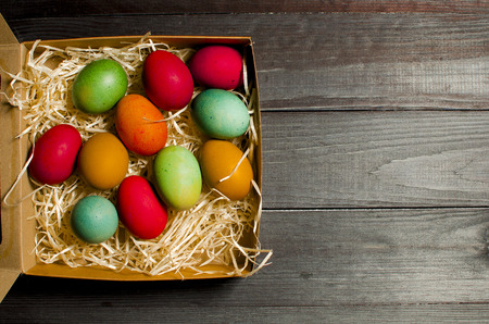 Painted chicken eggs for the traditional Christian holiday Easter on a wooden background. Painted eggs. Easter concept. Easter eggsの写真素材