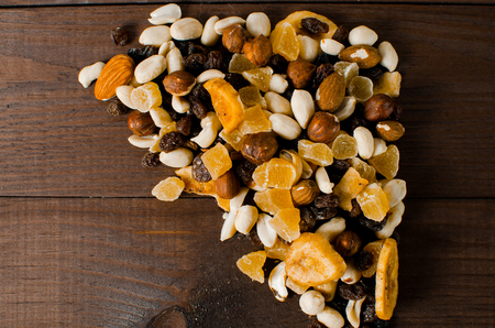 Dried fruits lie on a wooden background. Healthy Eatingの写真素材