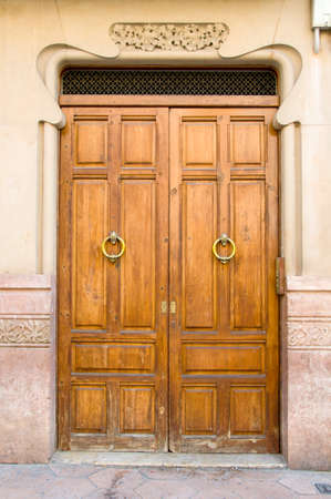 Entrance wooden door on a white background.の写真素材