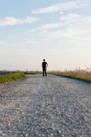 Man alone on the roadの写真素材