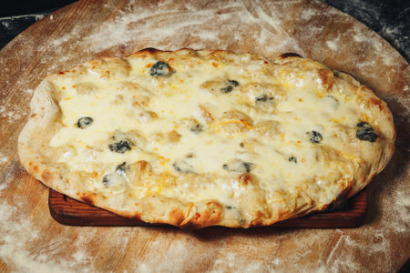 Sizzling Slice: Tempting Pizza on Wooden Boardの写真素材