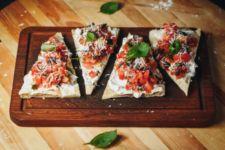 Succulent Slices: Pizza Perfection on Wooden Boardの写真素材