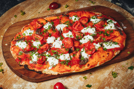 Tempting Margherita Pizza on Rustic Wooden Boardの写真素材