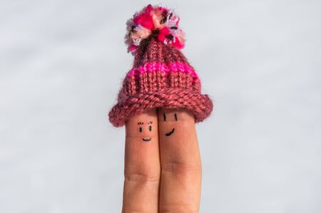 Happy fingers on a snow beautiful backgroundの写真素材