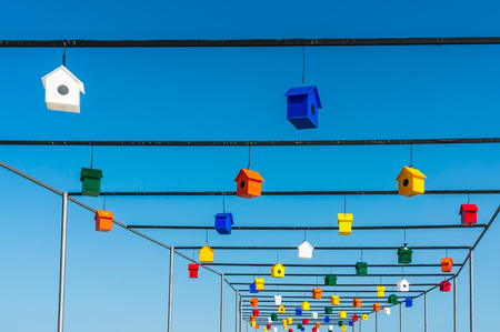 Nesting boxes or birdhouses for birds on blue sky backgroundの写真素材