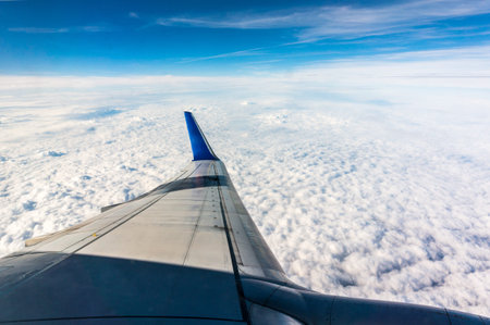 Looking through window airplane during flight in wing