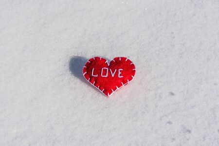 Beautiful heart on a snow backgroudの写真素材