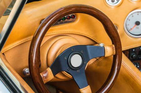 Steering wheel and dashboard inside the luxury brown carの写真素材