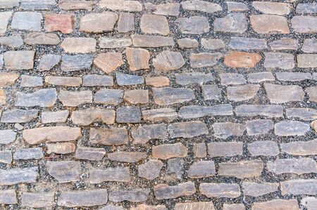 Cobblestone pavement on street in Prague, cobbled road backgroundの写真素材