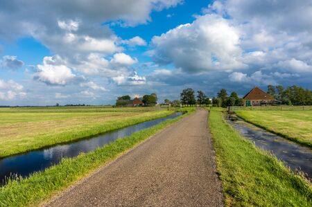 House next to the channel it is life in the Netherlandsの写真素材