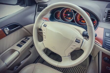 Steering wheel and dashboard inside the luxury carの写真素材