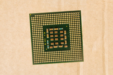 Computer processor chip (CPU) isolated on carton background