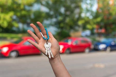 All savings money from pink ceramic piggy bank to pay for the dream car on blurred background