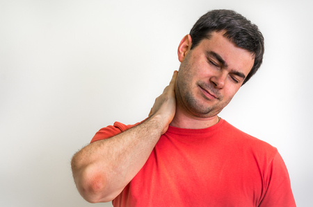 Man with muscle injury having pain in his neck - body painの写真素材