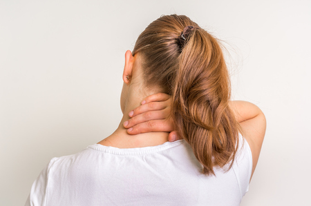 Woman with muscle injury having pain in her neck - body painの写真素材